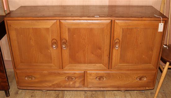 An Ercol elm sideboard W.130cm